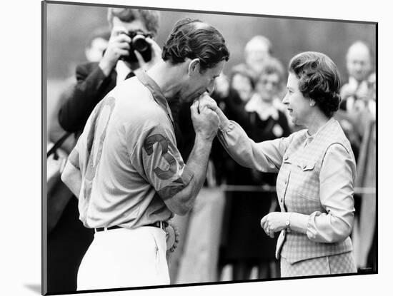 Prince Charles Kisses Hand of Mother Queen Elizabeth II After Presented with a Consolation Prize-null-Mounted Photographic Print