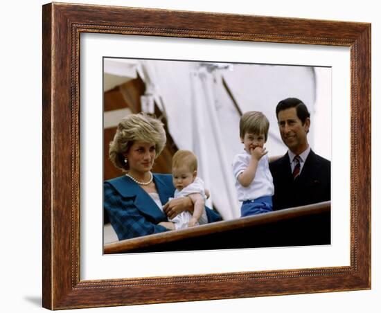 Prince Charles stands holding sons Prince William and Prince Harry with Princess Diana, Circa 1985-null-Framed Photographic Print