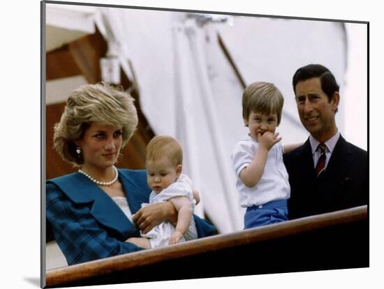 Prince Charles stands holding sons Prince William and Prince Harry with Princess Diana, Circa 1985-null-Mounted Photographic Print
