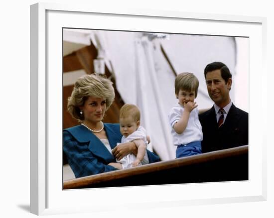 Prince Charles stands holding sons Prince William and Prince Harry with Princess Diana, Circa 1985-null-Framed Photographic Print
