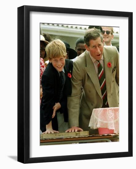 Prince Charles with Son Prince Harry Leaving Hand Prints in Concrete During Tour in South Africa-null-Framed Photographic Print