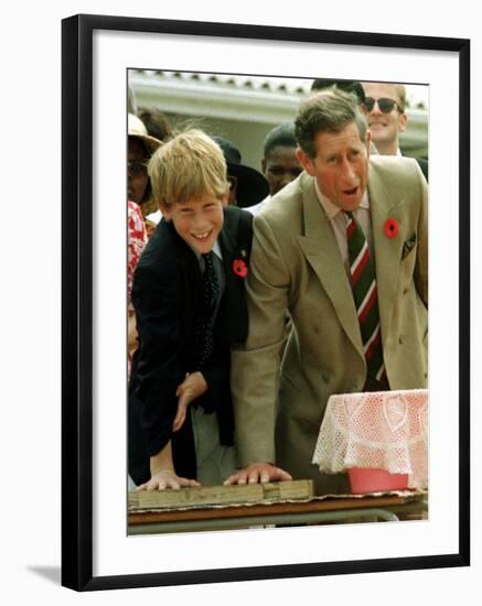 Prince Charles with Son Prince Harry Leaving Hand Prints in Concrete During Tour in South Africa-null-Framed Photographic Print