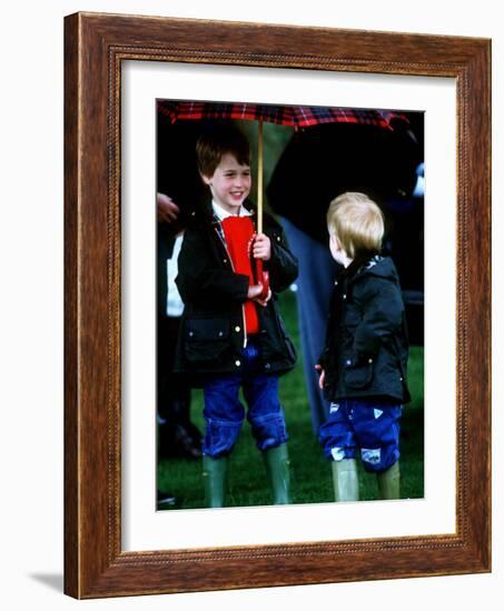 Prince Harry on right with Prince William at a polo match in Cirencester-null-Framed Photographic Print