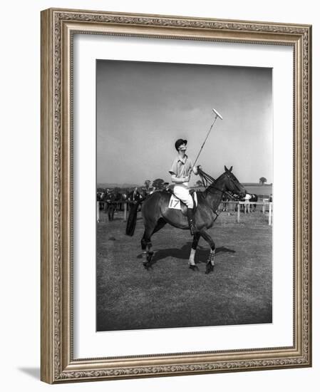 Prince Philips Rides Along on Horseback Holding Polo Stick During Game-null-Framed Photographic Print