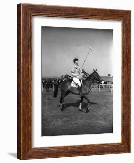 Prince Philips Rides Along on Horseback Holding Polo Stick During Game-null-Framed Photographic Print