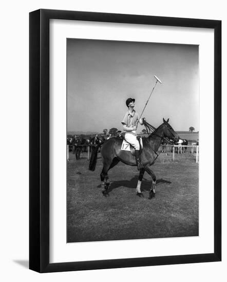 Prince Philips Rides Along on Horseback Holding Polo Stick During Game-null-Framed Photographic Print