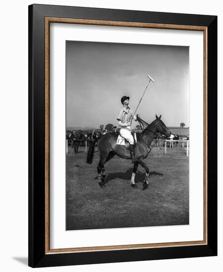 Prince Philips Rides Along on Horseback Holding Polo Stick During Game-null-Framed Photographic Print