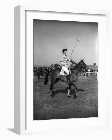 Prince Philips Rides Along on Horseback Holding Polo Stick During Game-null-Framed Photographic Print