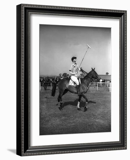 Prince Philips Rides Along on Horseback Holding Polo Stick During Game-null-Framed Photographic Print