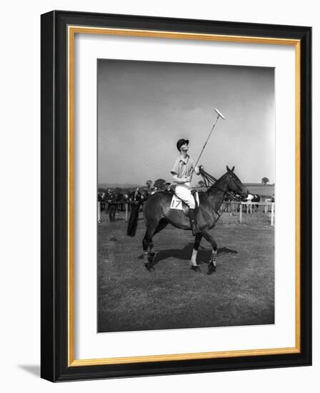 Prince Philips Rides Along on Horseback Holding Polo Stick During Game-null-Framed Photographic Print