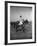 Prince Philips Rides Along on Horseback Holding Polo Stick During Game-null-Framed Photographic Print