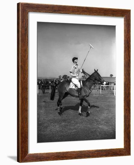 Prince Philips Rides Along on Horseback Holding Polo Stick During Game-null-Framed Photographic Print