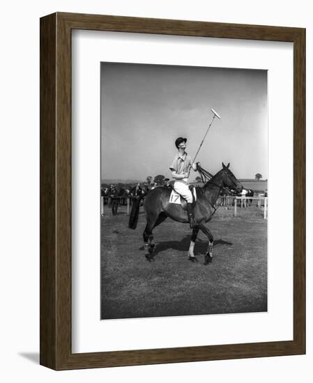 Prince Philips Rides Along on Horseback Holding Polo Stick During Game-null-Framed Photographic Print