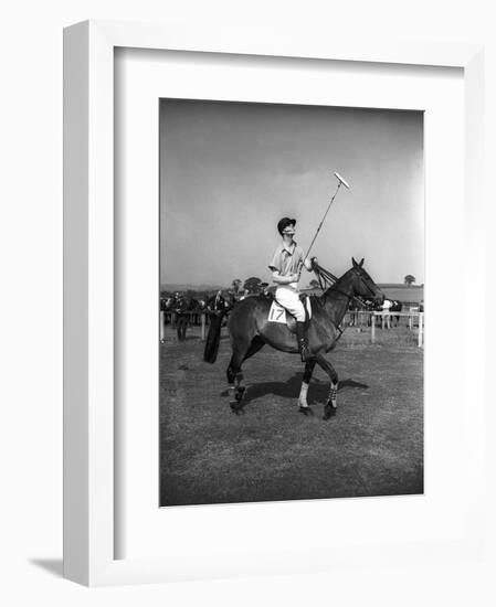 Prince Philips Rides Along on Horseback Holding Polo Stick During Game-null-Framed Photographic Print