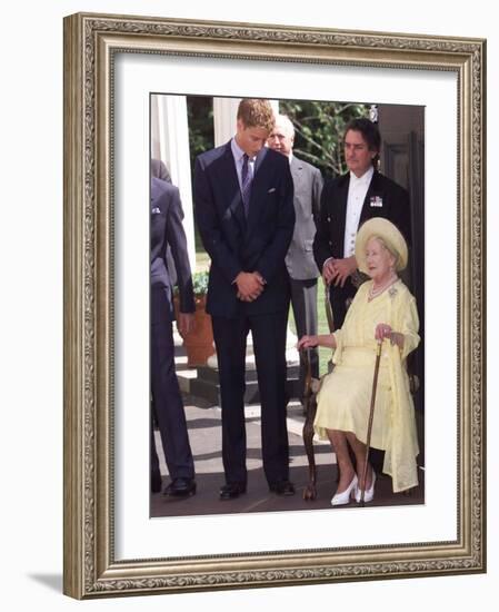 Prince William bends down to talk to The Queen Mother outside Clarence House where she was celebrat-null-Framed Photographic Print