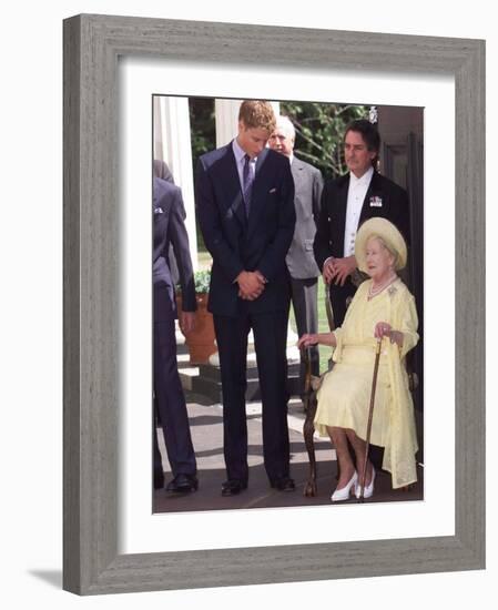 Prince William bends down to talk to The Queen Mother outside Clarence House where she was celebrat-null-Framed Photographic Print