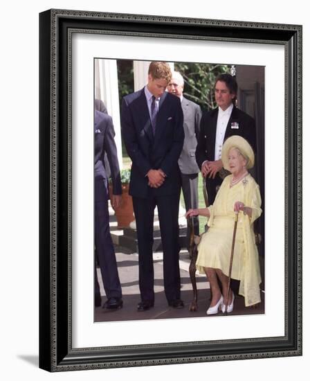 Prince William bends down to talk to The Queen Mother outside Clarence House where she was celebrat-null-Framed Photographic Print