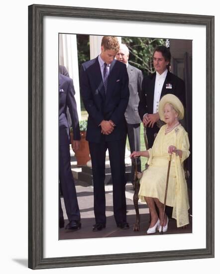 Prince William bends down to talk to The Queen Mother outside Clarence House where she was celebrat-null-Framed Photographic Print