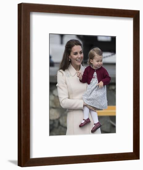 Princess Charlotte held by her mother Kate-Associated Newspapers-Framed Photo