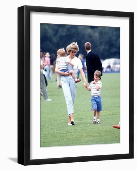 Princess of Wales with Prince Harry and Prince William at a polo match at Windsor-null-Framed Photographic Print