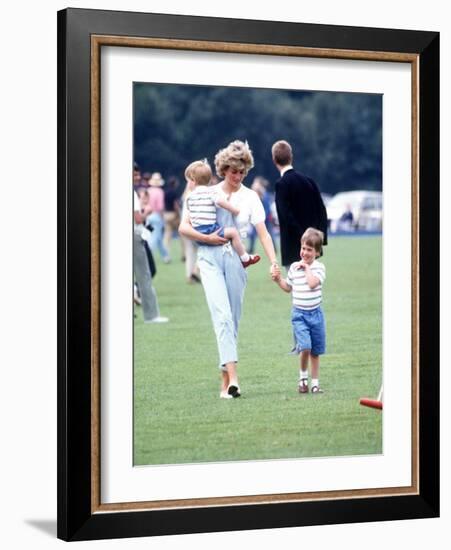 Princess of Wales with Prince Harry and Prince William at a polo match at Windsor-null-Framed Photographic Print