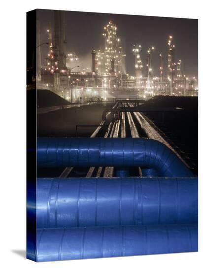 michael-melford-night-view-of-the-lights-of-an-oil-refinery_a-l-6118504-4990703.jpg?w=550&h=550
