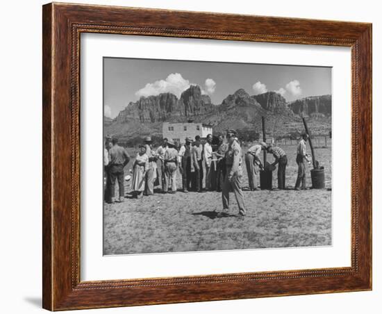 Prisoner Polygamists Lining Up after Chow Beneath the Jagged Arizona Cliffs-Loomis Dean-Framed Photographic Print