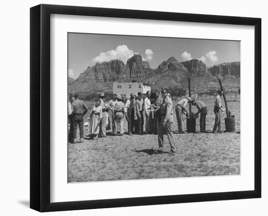 Prisoner Polygamists Lining Up after Chow Beneath the Jagged Arizona Cliffs-Loomis Dean-Framed Photographic Print