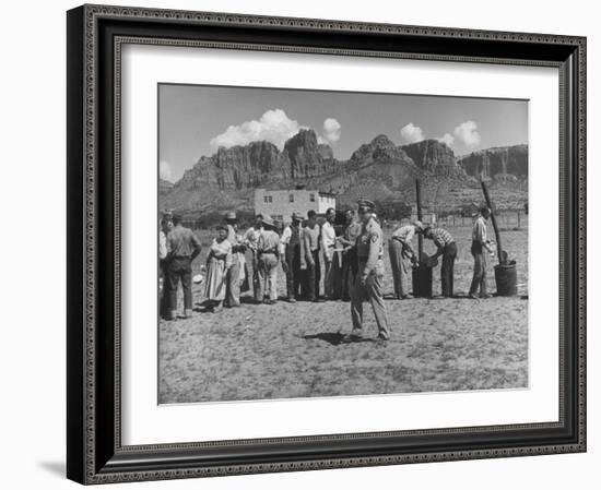 Prisoner Polygamists Lining Up after Chow Beneath the Jagged Arizona Cliffs-Loomis Dean-Framed Photographic Print