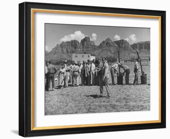 Prisoner Polygamists Lining Up after Chow Beneath the Jagged Arizona Cliffs-Loomis Dean-Framed Photographic Print