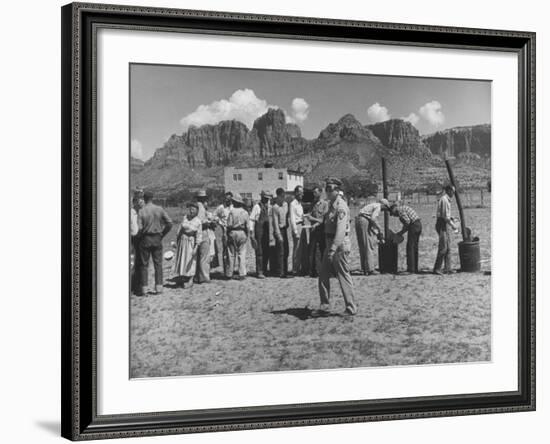 Prisoner Polygamists Lining Up after Chow Beneath the Jagged Arizona Cliffs-Loomis Dean-Framed Photographic Print