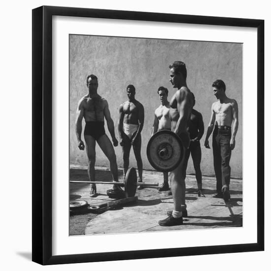 Prisoners at San Quentin Weightlifting in Prison Yard During Recreation Period-Charles E^ Steinheimer-Framed Photographic Print