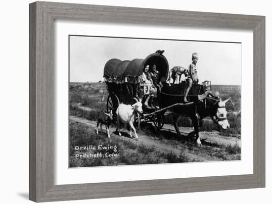 Pritchett, Colorado - Orville Ewing; Covered Wagon Scene-Lantern Press-Framed Art Print