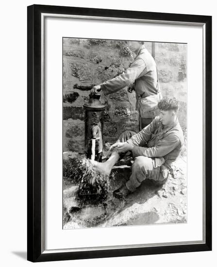 Private C. L. Scott of the 4th Infantry Division Is Washing His Feet at a Public Fountain-null-Framed Photographic Print