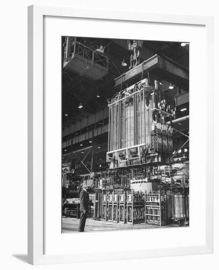 Prod Man George Hiser Watching as Completed Transformer Is Lowered into at General Electric Plant-null-Framed Photographic Print