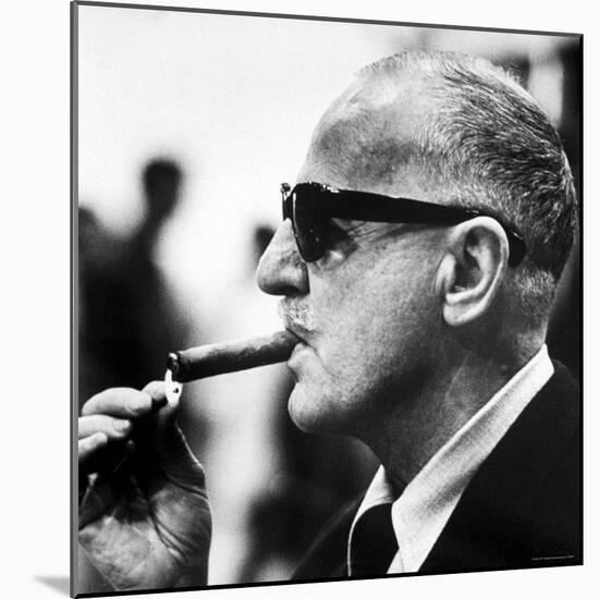 Producer Darryl F. Zanuck Lighting Cigar on the Set of Film "Rapture"-Carlo Bavagnoli-Mounted Premium Photographic Print