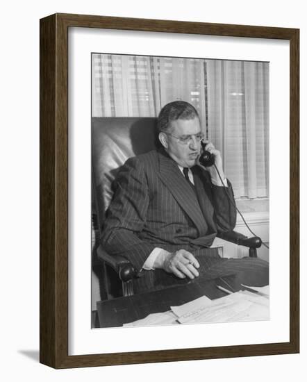 Producer David O. Selznick Sitting at His Desk, Talking on the Phone-null-Framed Photographic Print
