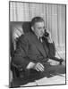 Producer David O. Selznick Sitting at His Desk, Talking on the Phone-null-Mounted Photographic Print