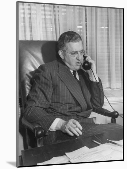Producer David O. Selznick Sitting at His Desk, Talking on the Phone-null-Mounted Photographic Print