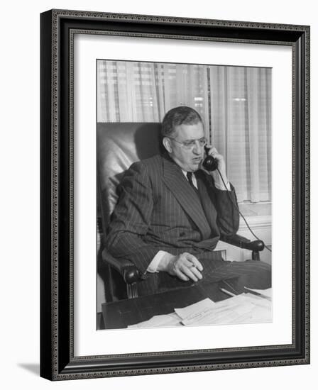 Producer David O. Selznick Sitting at His Desk, Talking on the Phone-null-Framed Photographic Print