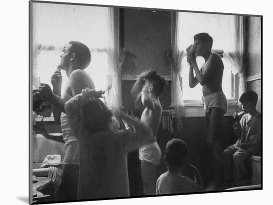 Professional Couple's Big Family, Sharing the Only Bathroom, Early in the Morning-Gordon Parks-Mounted Photographic Print
