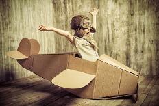 Cute Dreamer Boy Playing with a Cardboard Airplane. Childhood. Fantasy, Imagination. Retro Style.-prometeus-Photographic Print