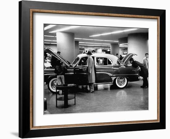 Prospective Buyers Looking over New Dodge Royal at Chrysler Show Room-Ralph Morse-Framed Photographic Print