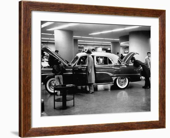 Prospective Buyers Looking over New Dodge Royal at Chrysler Show Room-Ralph Morse-Framed Photographic Print