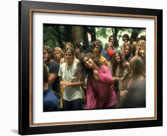 Psylvia Dressed in Pink Indian Shirt, Dancing in Midst of Crowd During Woodstock Music/Art Festival-Bill Eppridge-Framed Photographic Print