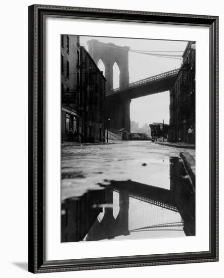 Puddle Reflecting Brooklyn Bridge-Bettmann-Framed Photographic Print