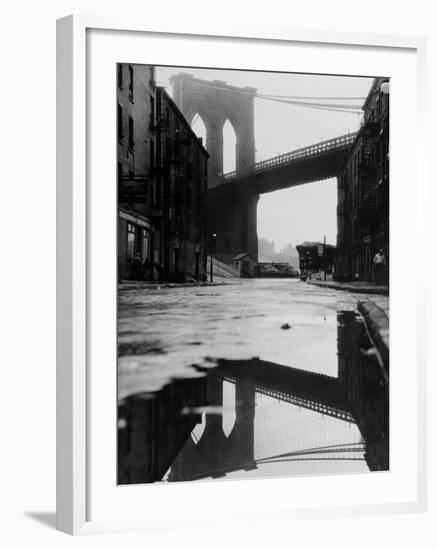 Puddle Reflecting Brooklyn Bridge-Bettmann-Framed Photographic Print