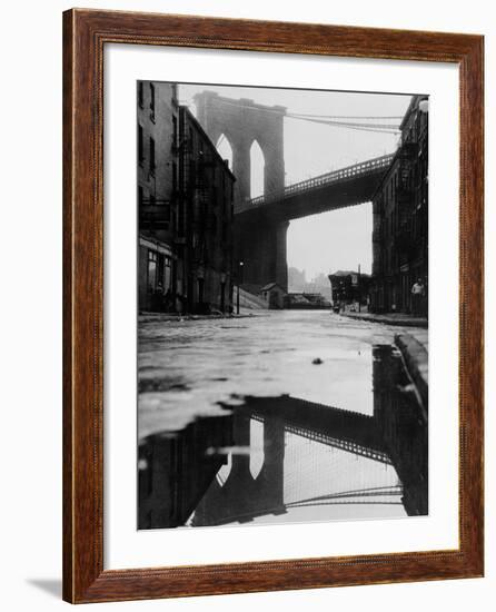 Puddle Reflecting Brooklyn Bridge-Bettmann-Framed Photographic Print