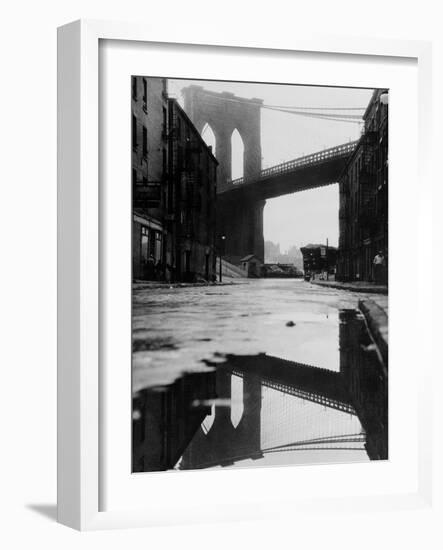 Puddle Reflecting Brooklyn Bridge-Bettmann-Framed Photographic Print