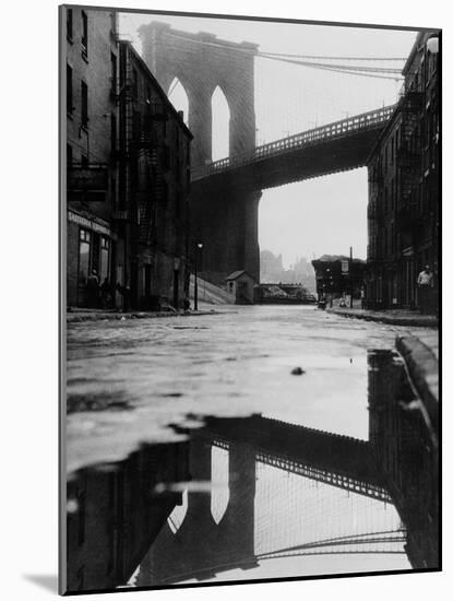 Puddle Reflecting Brooklyn Bridge-Bettmann-Mounted Photographic Print